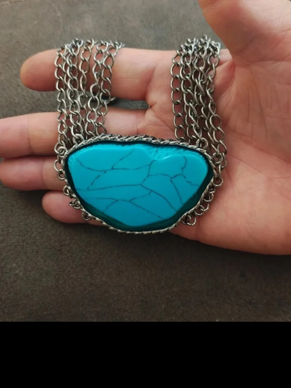 Silver Tone Multi Strand Chain Statement Necklace With a Faux Turquoise Stone